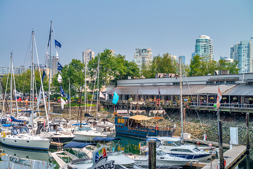 Vancouver, Canada - August 10, 2017: Boats berthed at the Fisherman Wharf piers in False Creek marina close to Granville Island