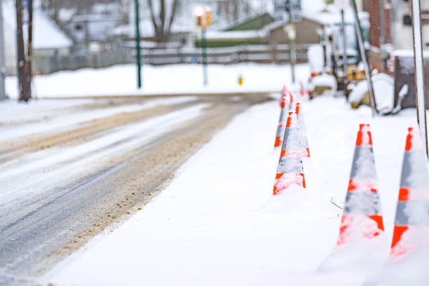 istock Street road work cones covered in snow, road work, construction 1385241680
