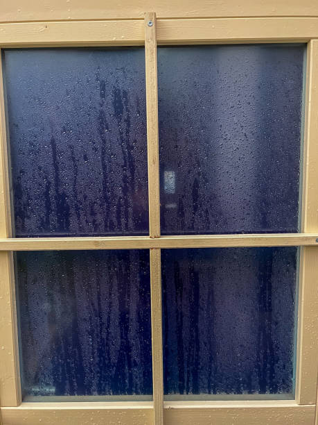 istock Dark windows of a summerhouse. 1385251152