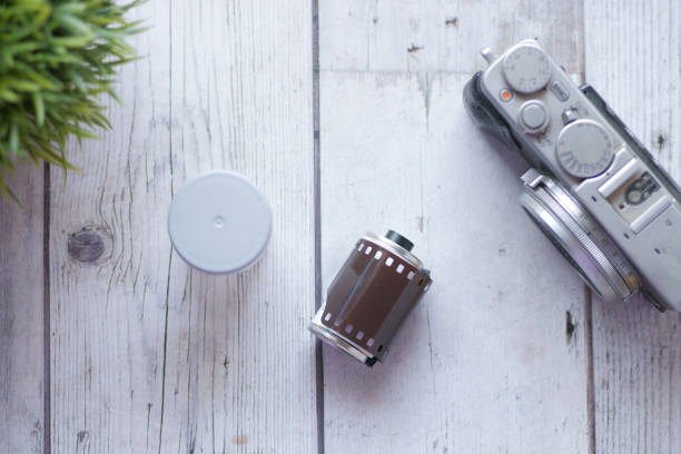 istock Top view of camera with film rolls on table 1385270404