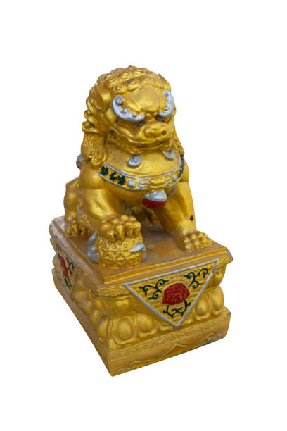 istock Golden lion statue isolated on white background. 1385275965