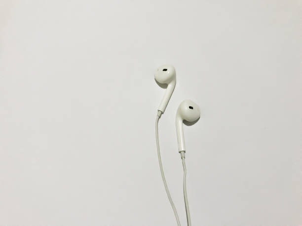 istock White earphone isolated on white background with copy space background . white modern headphones with a headset on a light gray background. concept of digital music 1385279178