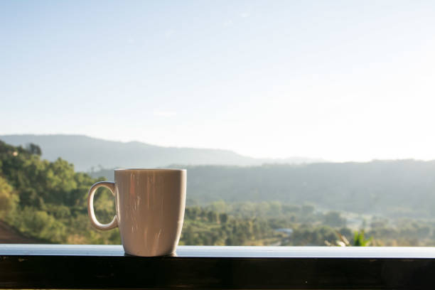 istock White coffee cup with mountain view in the morning 1385279222