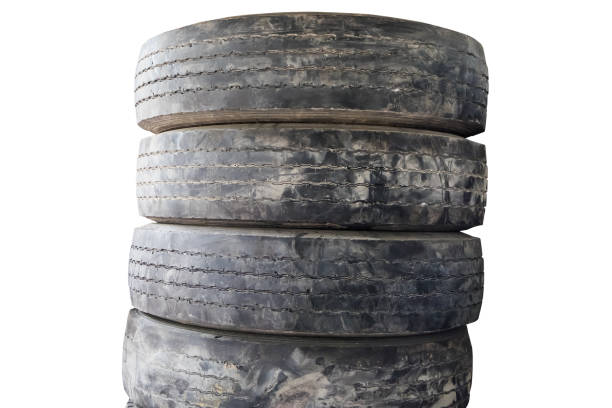 istock Old car tires pile isolated on white background 1385284494