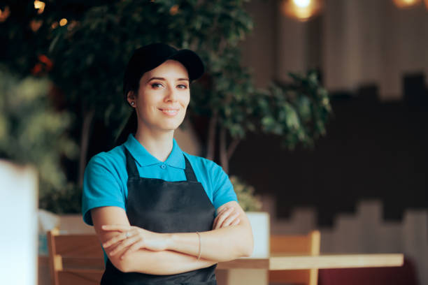 istock Happy Restaurant Waitress Smiling Standing with Arms Crossed 1385292728