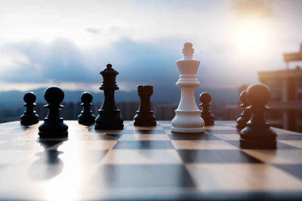 istock White chess king battle with black chess pieces 1385299409
