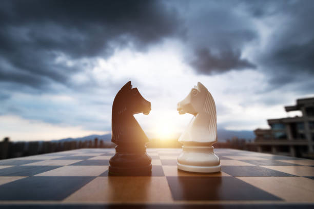 Two chess knights on city background Two chess knights on city background. knight chess piece stock pictures, royalty-free photos & images
