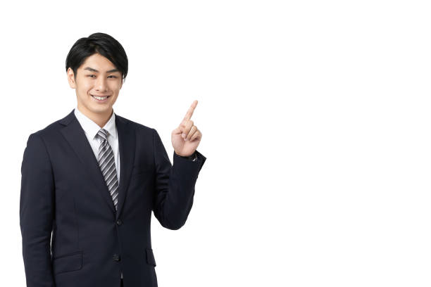 uomo d'affari asiatico che indica con un sorriso - business person isolated on white waist up business foto e immagini stock