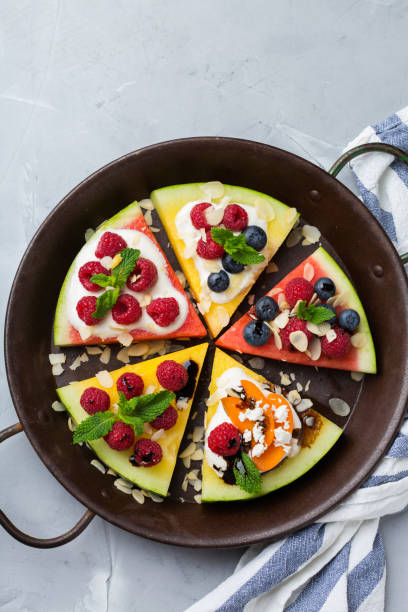 istock Watermelon pizza with berries, fruit, yogurt, feta cheese 1385310387