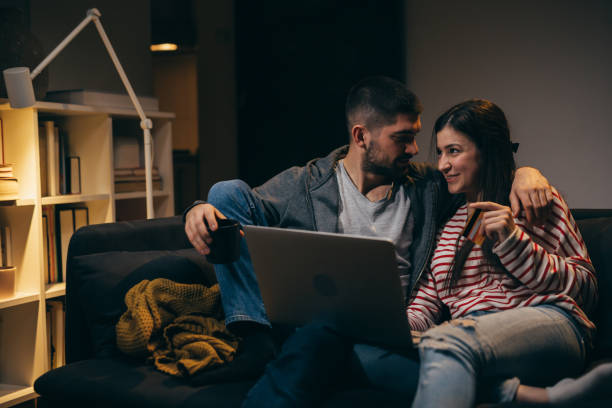 istock young couple enjoying time at home. evening scene 1385311005