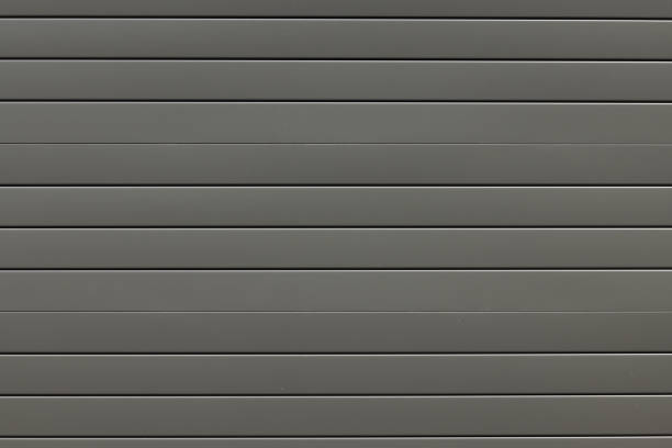 istock Dark olive colored metal garage door 1385311115