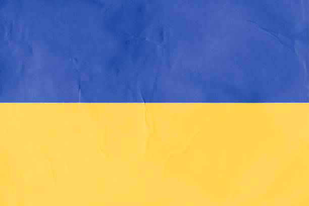 istock Ukraine flag on paper texture background 1385321755