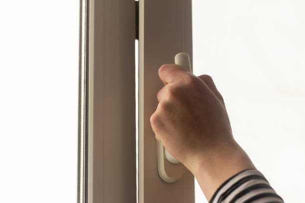 istock A hand opens a window in an apartment or house for ventilation. 1385323475
