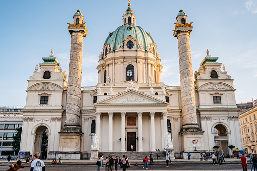 25 October 2019 Vienna, Austria -Wiener Karlskirche / Saint Charles's Church. Many tourists on streets. Art landmark.