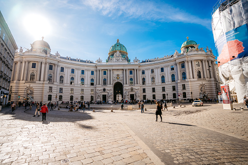 Vienna, Austria - October 24, 2019: Hofburg Palace, Kaiserappartements. Tourists walking on the town square in front of the Hofburg Complex in Vienna, the winter residence of the Habsburg dynasty.