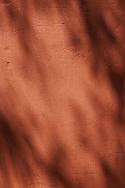 istock Part of a concrete wall with shadows 1385326003