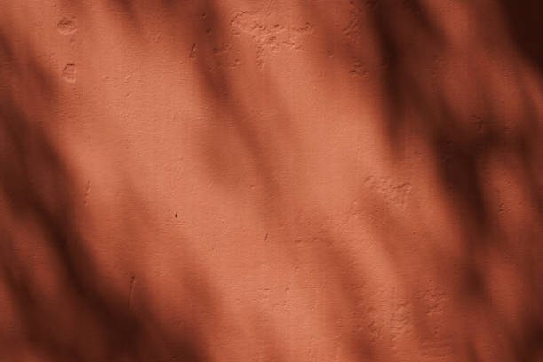 istock Part of a concrete wall with shadows 1385326004