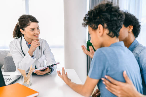 istock Black boy having a medical exam at doctor's office 1385326670