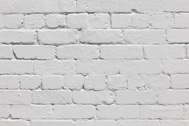 istock Part of an old brick wall painted gray 1385327036