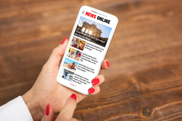 istock Person reading news on mobile phone 1385328538