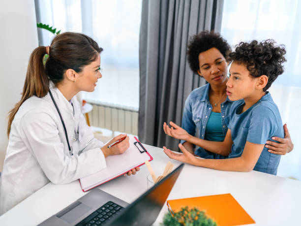 istock Black boy having a medical exam at doctor's office 1385333570