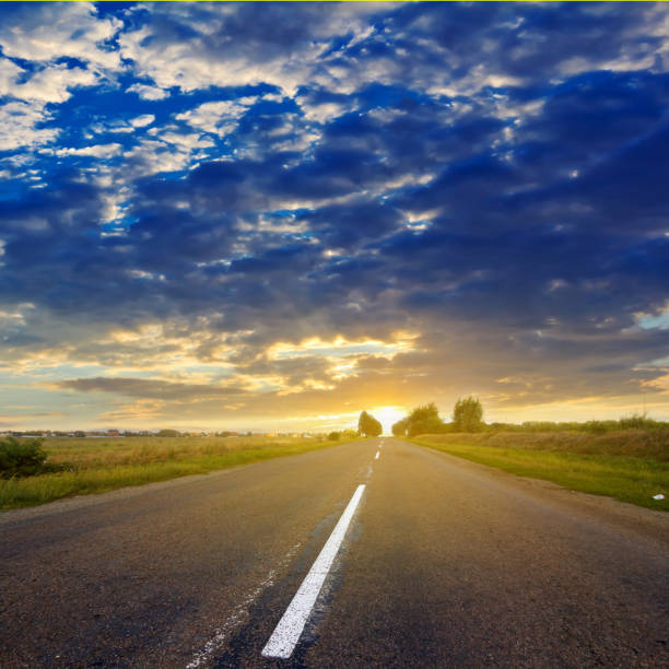 istock asphalt road at the sunset 1385337661