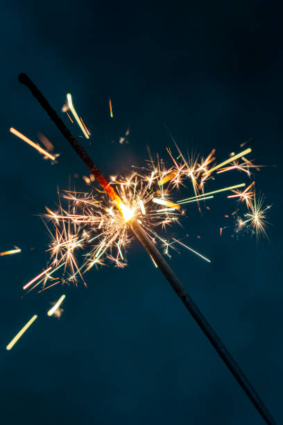 istock Christmas bengal fire sparkles against the black background. 1385341068