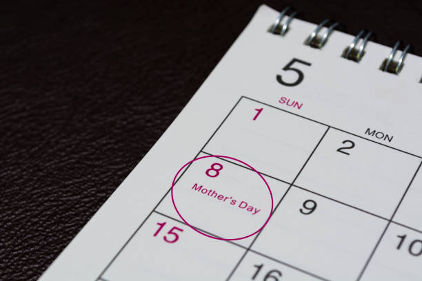 istock May calendar on dark background with date circle for Happy Mother's Day. 1385357561