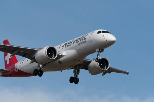 helvetic airways embraer e190-e2 airplane arrival in zurich in switzerland - helvetic imagens e fotografias de stock