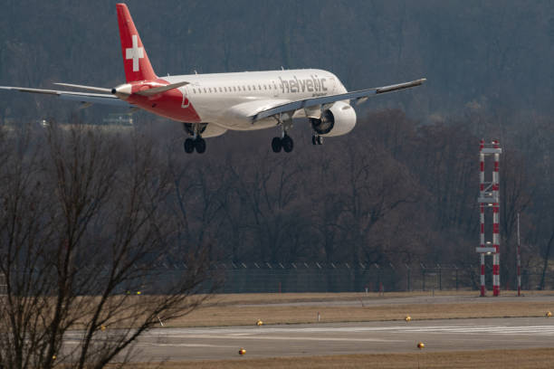 helvetic airways embraer e190-e2 jet arrival in zurich in switzerland - helvetic imagens e fotografias de stock