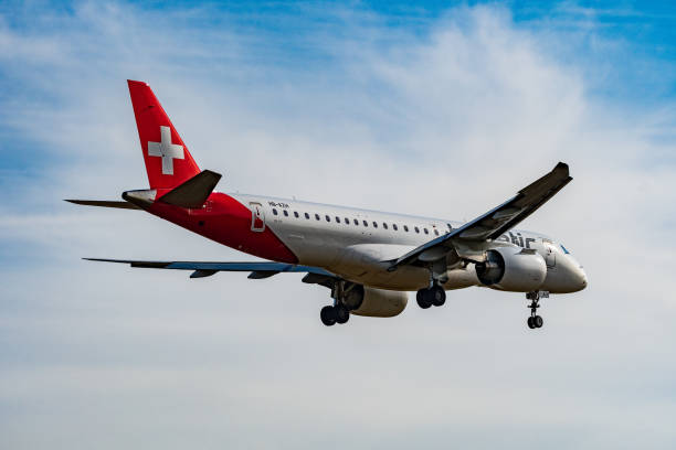 helvetic airways embraer e190-e2 airplane arrival in zurich in switzerland - helvetic imagens e fotografias de stock