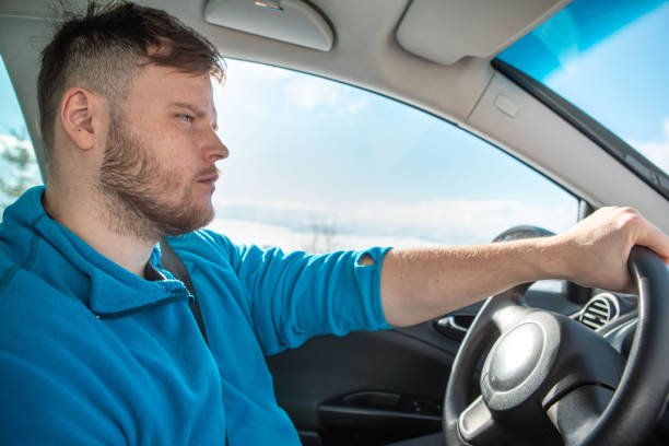 istock man hands on steering wheel winter road trip 1385364489