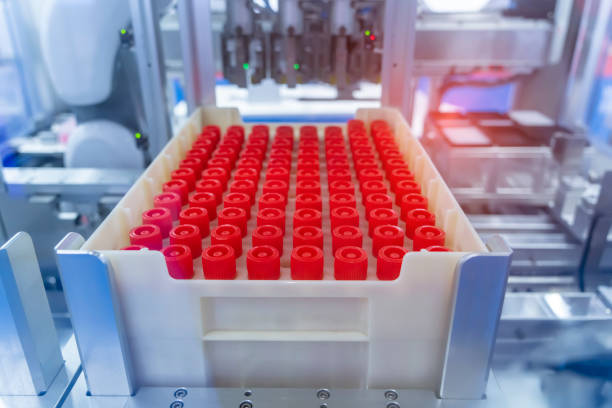 istock Robot arm with test tube for biological experiments in laboratory 1385367727