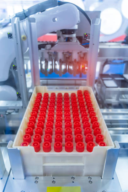 istock Robot arm with test tube for biological experiments in laboratory 1385367785