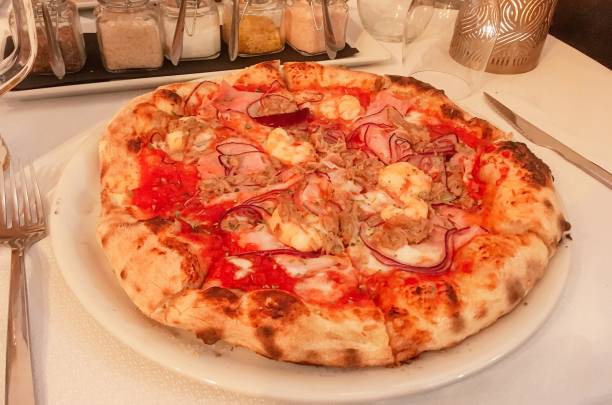 istock Tuna and seafood thick crust pizza. 1385367979