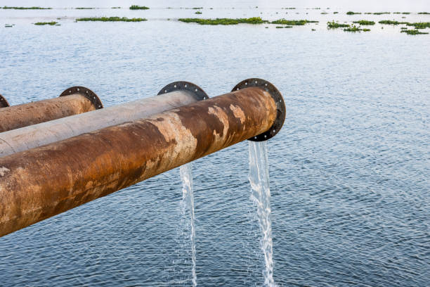 istock Close up shot of rustic dredging pipeline on the river 1385368518
