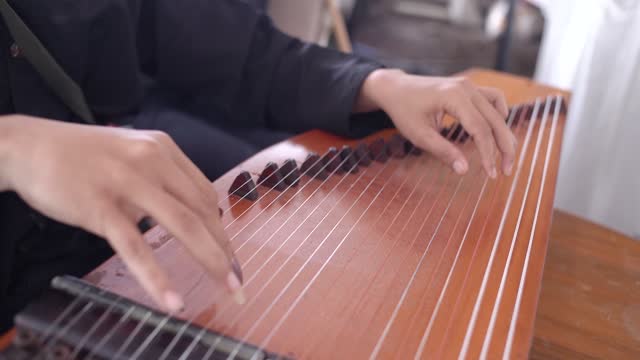 Kecapi - a traditional musical instrument from Indonesia, usually played by plucking like a guitar. This harp musical instrument is almost the same as the harp