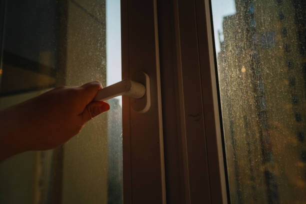 istock Open the window by hand in the morning 1385373444