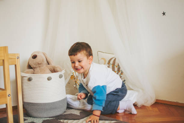 istock Happy young boy playing in the bedroom 1385376586