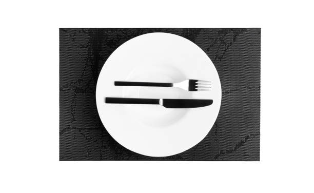 istock Sign language with cutlery. A plate with cutlery isolated on a white background. Plate, knife, fork on a white background 1385376621