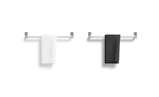 istock Blank black and white twisted towel on heated rail mockup 1385380839