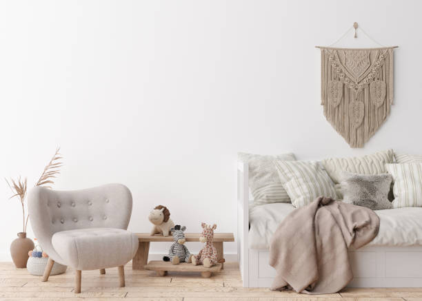 istock Empty white wall in modern child room. Mock up interior in scandinavian, boho style. Free, copy space for your picture, poster. Bed, dried grass, vase, macrame, toys. Cozy room for kids. 3D rendering. 1385380841