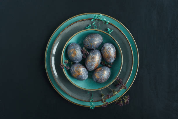 istock Easter concept of coloring eggs in hibiscus. 1385381081
