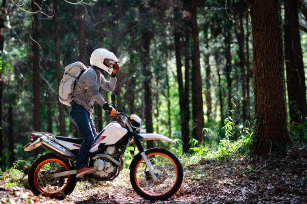 istock A man riding an off-road motorcycle on a mountain road 1385385297