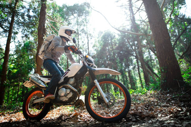 istock A man riding an off-road motorcycle on a mountain road 1385385298