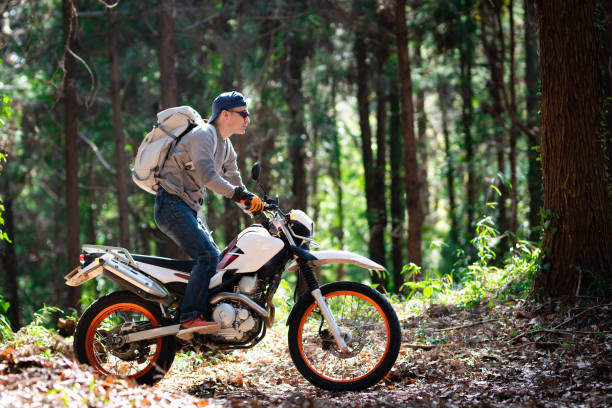 istock A man riding an off-road motorcycle on a mountain road 1385385301