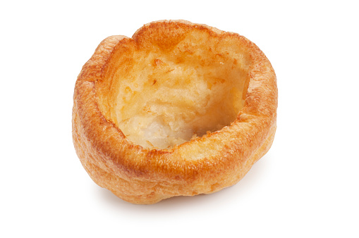 Studio shot of a baked Yorkshire Pudding cut out against a white background
