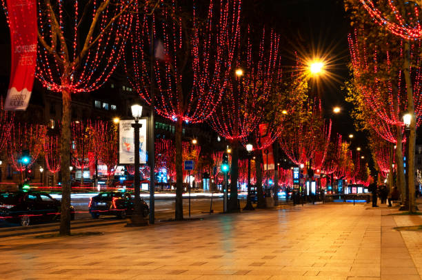 Paris : Champs-Elysees avenue for Christmas, with red light garlands in trees. stock photo