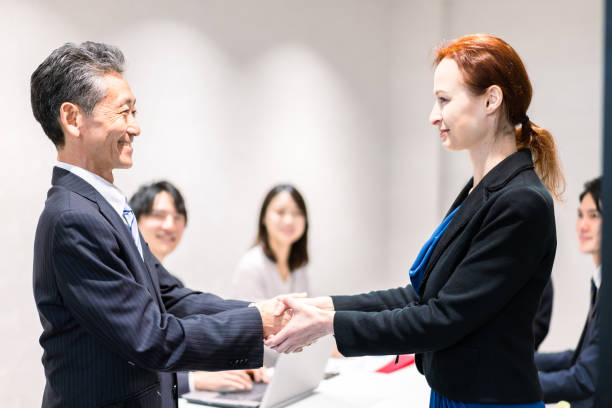 istock Business people signing a contract 1385392557
