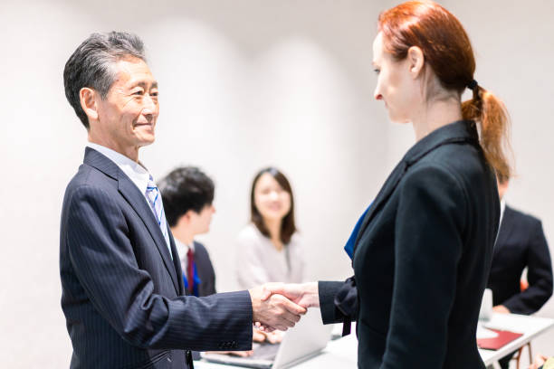 istock Business people signing a contract 1385392560